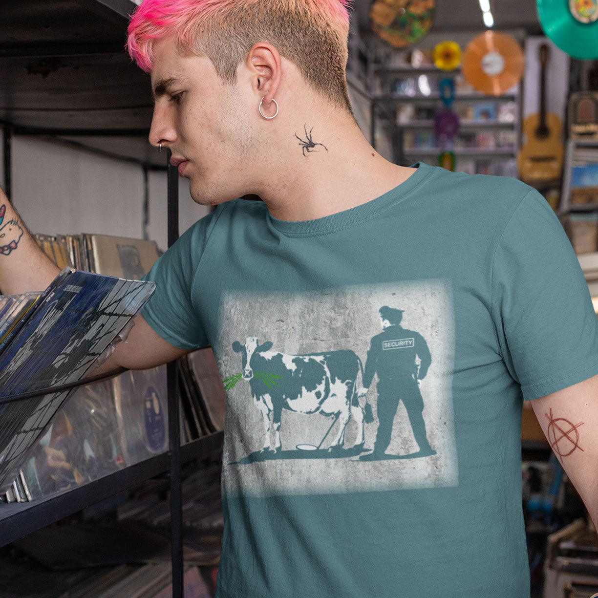 The thin line between security and invasion of privacy highlighted with graffiti stencil art. Made from 100% organic ring-spun cotton, this unisex t-shirt is a total must-have. It's high-quality, super comfy, and best of all—eco-friendly.