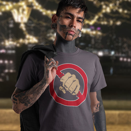 Person wearing a t-shirt with a fist logo against a blurred cityscape background. Non conformist t shirt design. stencil graffiti art for people who think boundaries stifle creativity, and rules are only guidelines. This alternative, anti establishment t-shirt is perfect for any demonstration or protest march of your choice. Made from 100% organic ring-spun cotton, this urban art t shirt is unisex, high-quality, super comfy, and best of all, eco-friendly.
