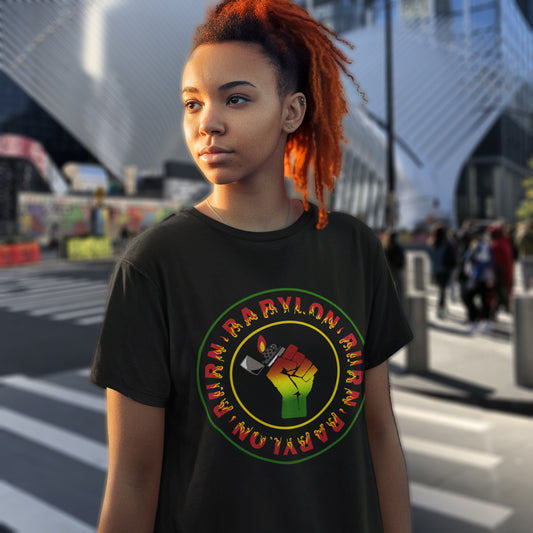 Person wearing a black t-shirt with a colourful graphic design on a city street. A Rastafarian civil rights t shirt. Babylon is the symbol of corruption and decadence. Take a leaf out of the Rastafarian book with this 'power to the people' anti government t-shirt. Made from 100% organic ring-spun cotton, this urban art t shirt is unisex, high-quality, super comfy, and best of all, eco-friendly.