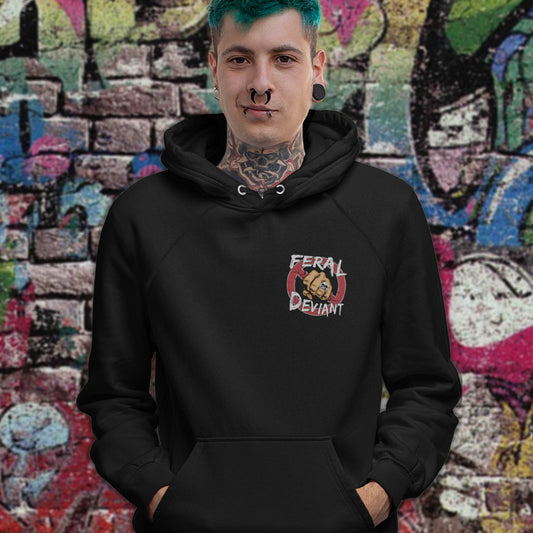 Person wearing a black hoodie with a logo in front of a colorful graffiti wall. A non conformist hoodie for people who think boundaries stifle creativity, and rules are only guidelines. This alternative, anti establishment hoodie is perfect for any demonstration or protest march of your choice. Comfortable and practical. It's extra soft and has a convenient front pouch pocket. Made from organic cotton and recycled polyester, this street art inspired hoodie is a great eco-friendly choice.