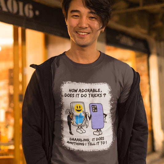 Person wearing a anthracite t-shirt with a graphic design and text, standing outdoors. An anti mobile phone abuse t-shirt depicting a twisted view of what's really going on in some peoples relationship with their mobile phone. Sometimes you have to wonder who owns who. An original design to promote social awareness. Made from 100% organic ring-spun cotton, this anti smart phone abuse t-shirt is unisex, high-quality, super comfy, and best of all, eco-friendly.