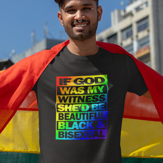 Person wearing a black t-shirt with rainbow-colored text and a rainbow flag in an urban setting. A liberal thinkers t-shirt design. LGBTQ+ friendly and anti-racism in one. If there is a God she's probably more open minded than people give her credit for. Made from 100% organic ring-spun cotton, this alternative view t-shirt is unisex, high-quality, super comfy, and best of all, eco-friendly.