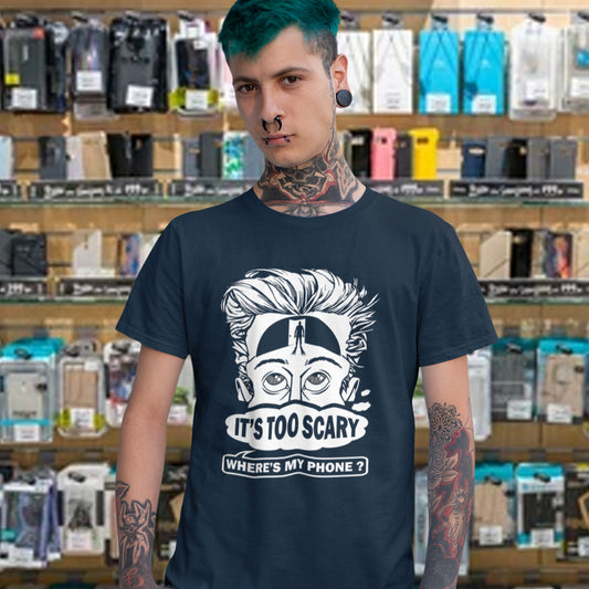 Person wearing a French navy t-shirt with a graphic design and text in a store setting. An anti-mobile phone abuse t-shirt highlighting the effects on the mind of smart phone over use in the place of thinking. A view of how mobile phones have taken over thinking and left us with dark unexplored corridors in our minds. Made from 100% organic ring-spun cotton, this social awareness t-shirt is unisex, high-quality, super comfy, and best of all, eco-friendly.