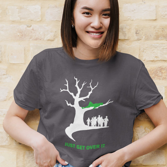 Person wearing an anthracite t-shirt with a graphic design and text, standing against a brick wall. This sarcastic slogan t shirt design is for everyone who doesn't need a motivational one liner to find their pace of life. Ideal for the laid back independent thinking individual. Made from 100% organic ring-spun cotton, this urban art t-shirt is unisex, high-quality, super comfy, and best of all, eco-friendly.