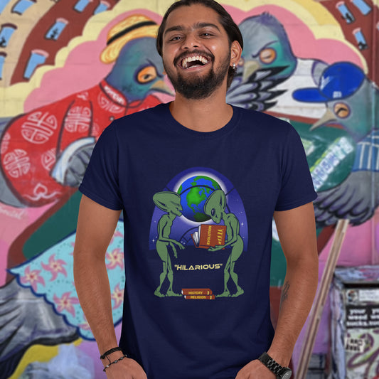 Person wearing a French navy blue t-shirt with an alien graphic and 'Hilarious' text, standing in front of a colourful mural. This funny alien t shirt suggest we are being lied to about our history and the aliens know the truth. A design for alien loving conspiracy theorists. Have the aliens had more influence in our lives than we are lead to believe ? Made from 100% organic ring-spun cotton, these cool sci fi t shirts are unisex, high-quality, super comfy, and best of all, eco-friendly.