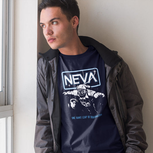 Man looking out of window wearing a French navy blue t shirt.