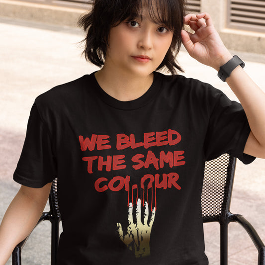 Girl wearing black t-shirt saying 'we bleed the same colour' sitting outside. This anti racism t-shirt design highlights how shallow racism is. show you stand against prejudice with this street style underground art on apparel. Made from 100% organic ring-spun cotton, this social awareness anti racism t-shirt is unisex, high-quality, super comfy, and best of all, eco-friendly.