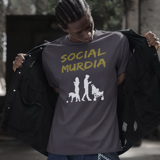 Person wearing a t-shirt with 'SOCIAL MURDIA' text and graphic design. An anti-social media t shirt arguing against the abuse of social media and mobile phones. The main aim of social media is to connect people, but it doesn't look like that from street level. This anti-mobile phone design suggests society is actually being murdered by media on mobiles. Made from 100% organic ring-spun cotton, this anti-social media t shirt is unisex, high-quality, super comfy, and best of all, eco-friendly.