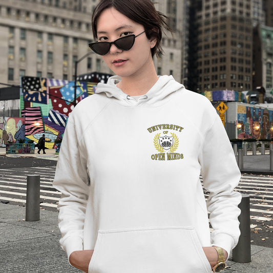 Person wearing a white hoodie with a logo and text, standing in an urban setting with colourful murals. A graphic hoodie design for the liberal minded. If you think outside the box then this university is for you. Only practical lessons and no student loan required. Comfortable and practical. It's extra soft and has a convenient front pouch pocket. Made from organic cotton and recycled polyester, this graphic hoodie is a great eco-friendly choice.