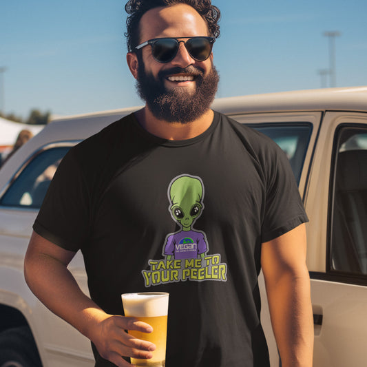A bearded man smiling and holding a beer, wearing sunglasses and a black short sleeved crew neck t-shit with a vegan alien design above "TAKE ME TO YOUR PEELER" text.