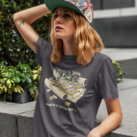 Person wearing a dark gray t-shirt with a graphic design and text, sitting outdoors. A satirical anti-war t-shirt suggesting we know what it's good for, money and land deeds for starters. Expose the big business of War with this unique design made for any anti-war demonstration. Made from 100% organic ring-spun cotton, this political t-shirt is unisex, high-quality, super comfy, and best of all, eco-friendly.