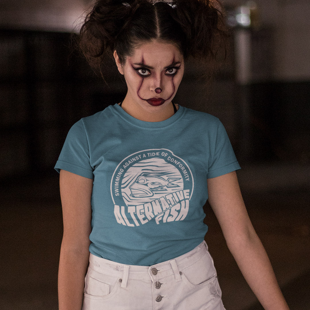 Woman with clown makeup wearing a stargazer blue T-shirt with An "ALTERNATIVE FISH" logo.
