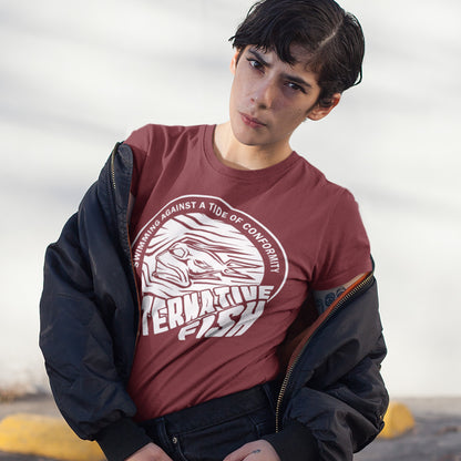 Person wearing a red t-shirt with a graphic design and text, standing against a neutral background. A non conformist t shirt for all who think outside the box. Don't just be another fish in the sea. Push back the tide of conformity with this anti establishment t shirt design. Made from 100% organic ring-spun cotton, this counter culture t shirt is unisex, high-quality, super comfy, and best of all, eco-friendly.