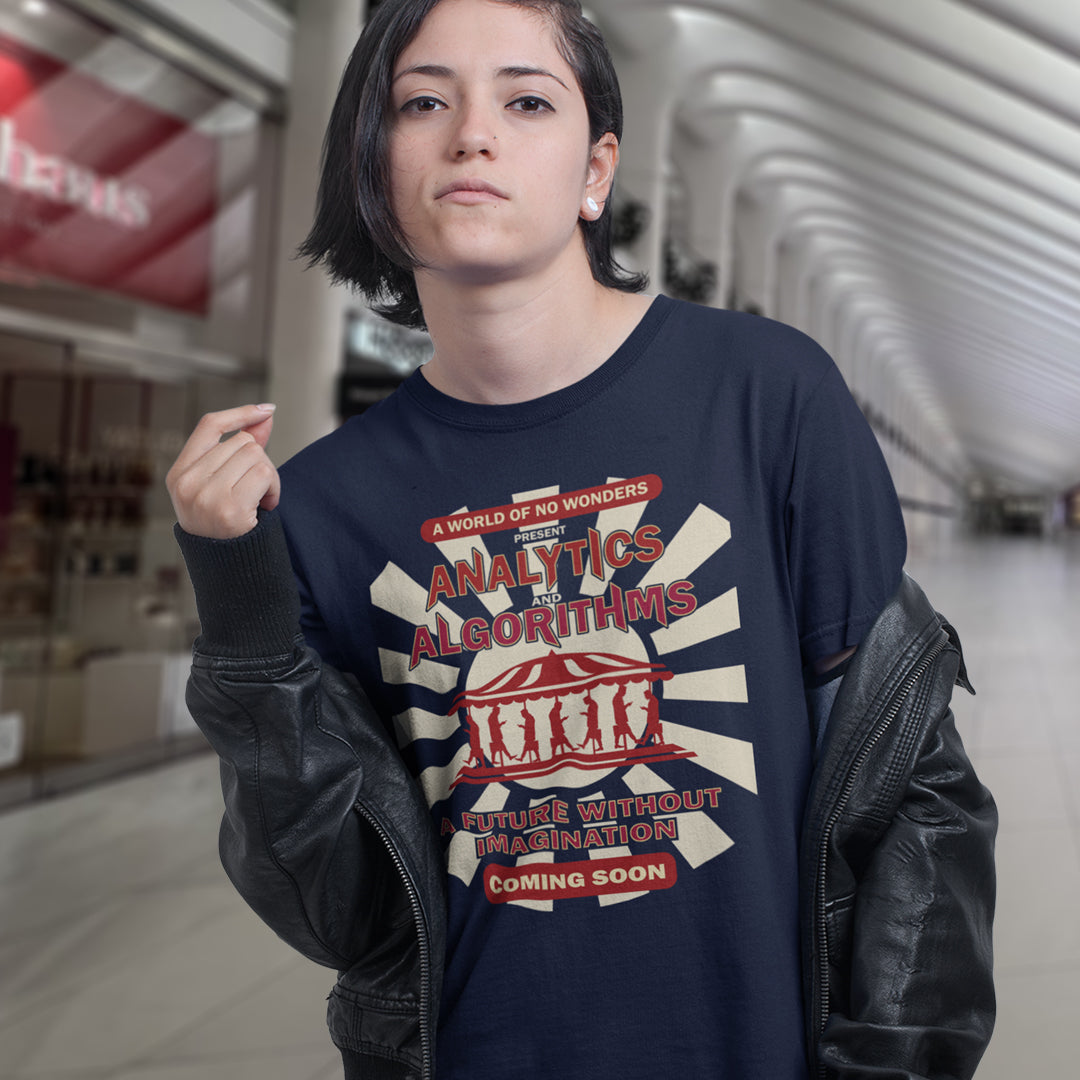 Woman in a shopping mall, wearing a French navy t shirt. A dystopian t shirt design suggesting that our future will be void of imagination, wonder and independent thinking under the increasing use of Analytics and algorithms. Our ever growing necessity for efficiency is reducing chance, risk, creativity and the very essence of living. imagination. Made from 100% organic ring-spun cotton, this non conformist t shirt is unisex, high-quality, super comfy, and best of all, eco-friendly.