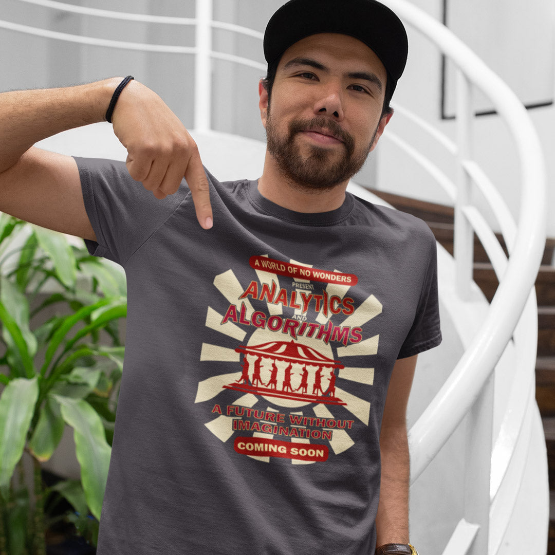 Man wearing an anthracite grey t-shirt outdoors with an "AVALYTICS AND ALGORITHMS" spoof fairground poster design.