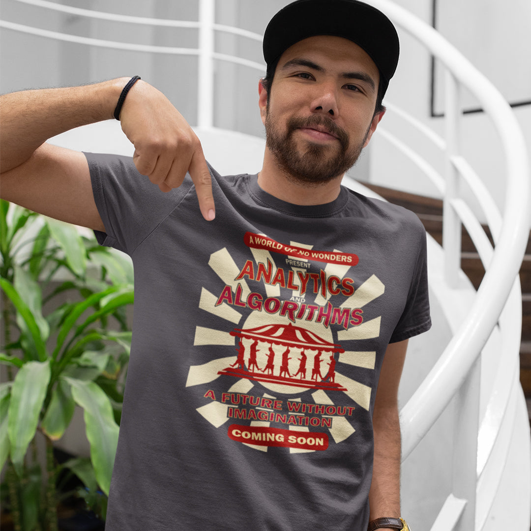 Man standing outside pointing at t shirt. A dystopian t shirt design suggesting that our future will be void of imagination, wonder and independent thinking under the increasing use of Analytics and algorithms. Our ever growing necessity for efficiency is reducing chance, risk, creativity and the very essence of living. imagination. Made from 100% organic ring-spun cotton, this non conformist t shirt is unisex, high-quality, super comfy, and best of all, eco-friendly.