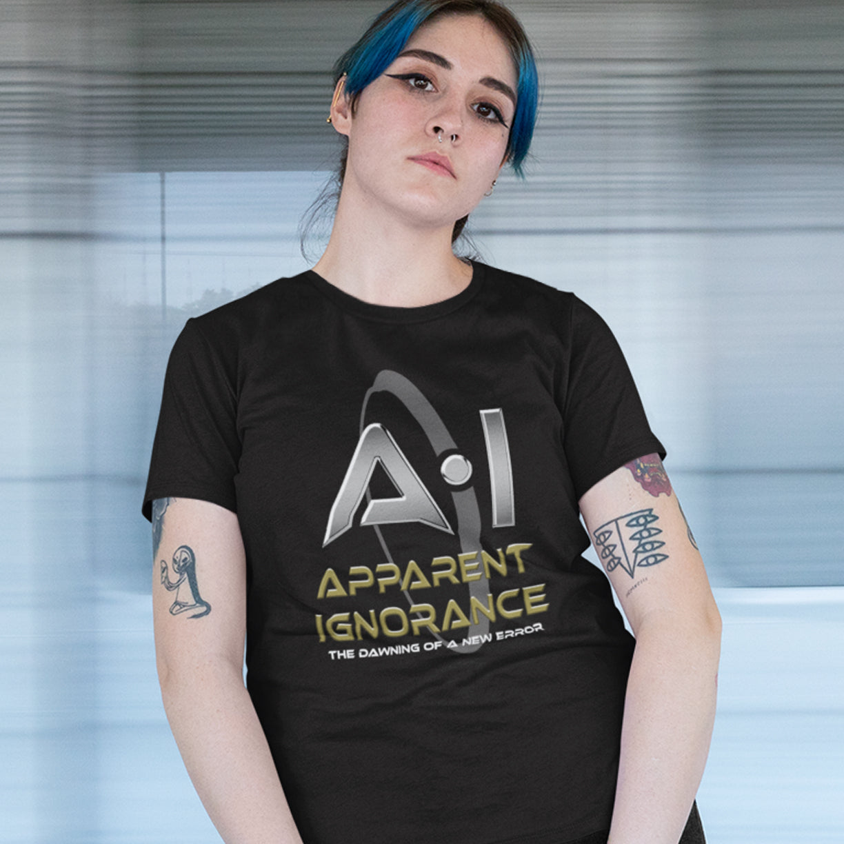 Person wearing a black t-shirt with 'Apparent Ignorance' logo and text. This anti ai t shirt design questions the effects of A.I on our society and suggests we are ignoring it's full effects. Whether you are concerned about technology taking people's jobs or worried about A.I doing our thinking for us. Made from 100% organic ring-spun cotton, this counter culture t shirt is unisex, high quality, super comfy, and best of all, eco-friendly.