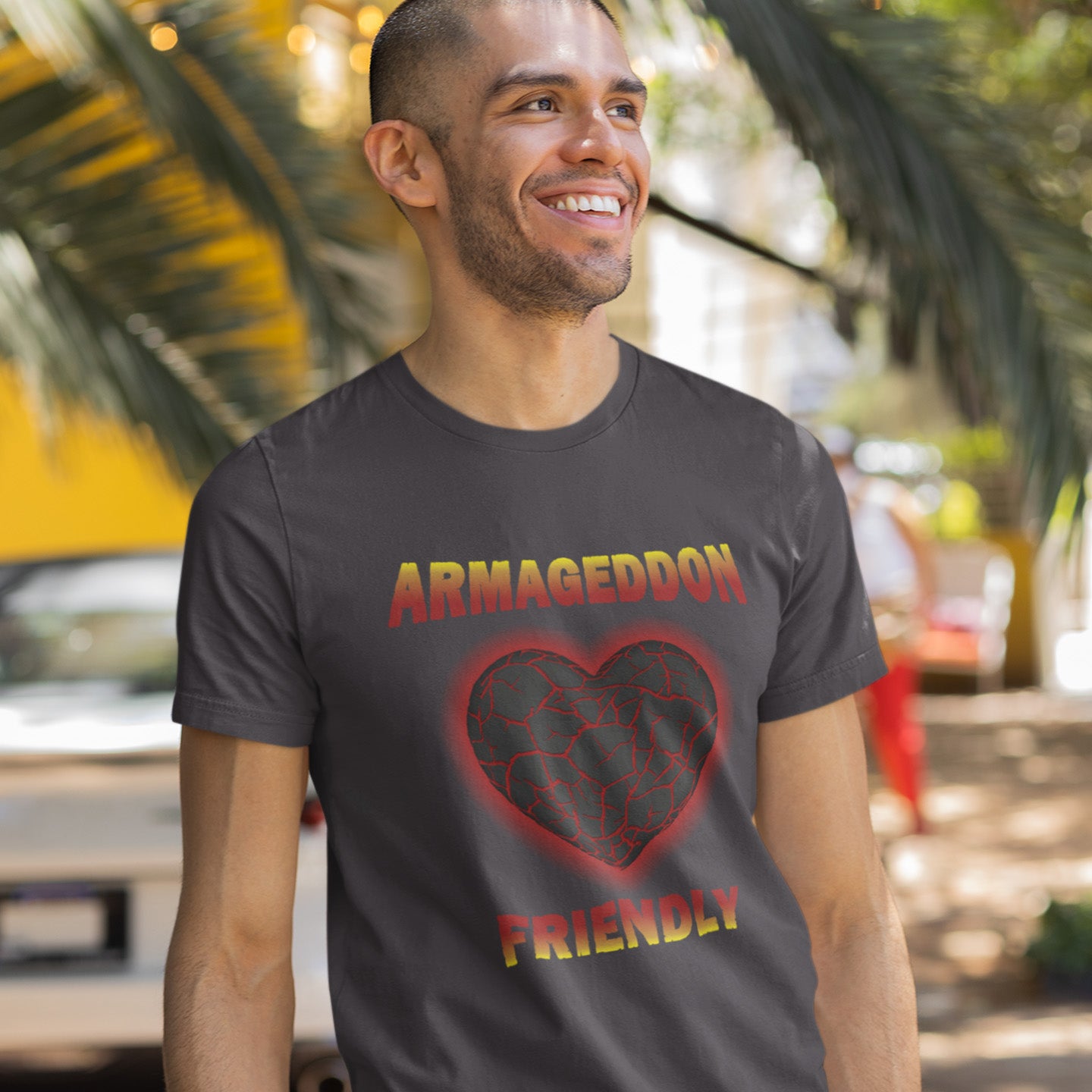 Man wearing a t-shirt with 'Armageddon Friendly' design outdoors. A non conformist t shirt design for the pessimist among us. If you find yourself losing faith in humankind, and feel your heart turning to stone, get it out of your system with this alternative counterculture design. Great for anyone who thinks outside the box. Made from 100% organic ring-spun cotton, this social awareness t shirt is unisex, high-quality, super comfy, and best of all, eco-friendly.