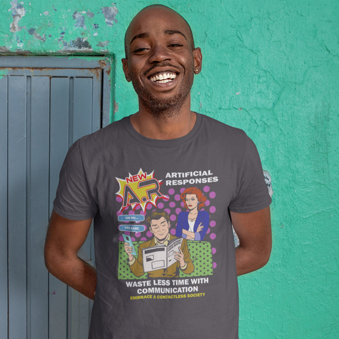 Man wearing a t-shirt with a graphic design against a teal wall. This anti ai t shirt design, in a comic book pop art style, warns against artificial intelligence taking over too many aspects of our lives. In an ever increasing dependency on artificial realities, just how far will it go ? Will our communication be artificial one day ? Satirical and sarcastic, funny but scary. Made from 100% organic ring-spun cotton, this anti ai t shirt is unisex, high-quality, super comfy, and best of all, eco-friendly.