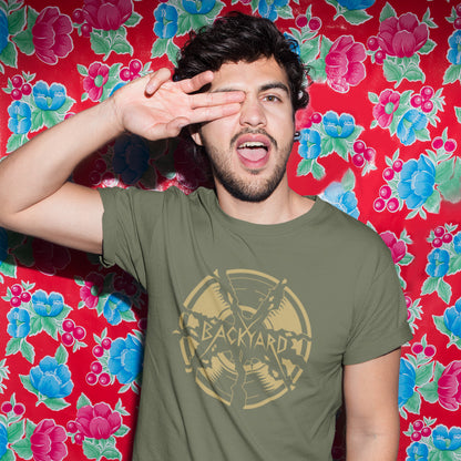 Man wearing a khaki t-shirt with a graphic design in front of a colourful floral background. A unique Backyard t-shirt. If you were there, you were there. If you know, you know and if you remember it you are lucky !! Eco friendly t shirt. Made from 100% organic ring-spun cotton, this nostalgic t-shirt is unisex, high-quality, super comfy, and best of all, eco-friendly.