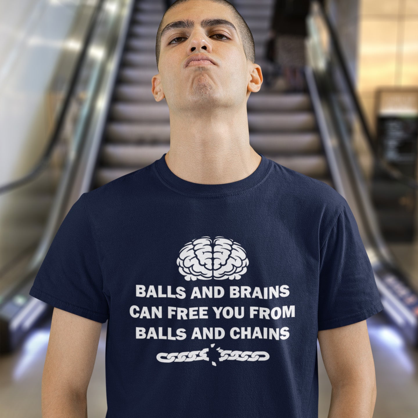 Person wearing a French navy blue t-shirt with white text and graphic, standing in front of an escalator. A civil liberties t shirt limerick to remind you of what it takes to free yourself, metaphorically speaking. Made from 100% organic ring-spun cotton, this self worth t shirt is unisex, high-quality, super comfy, and best of all, eco-friendly.