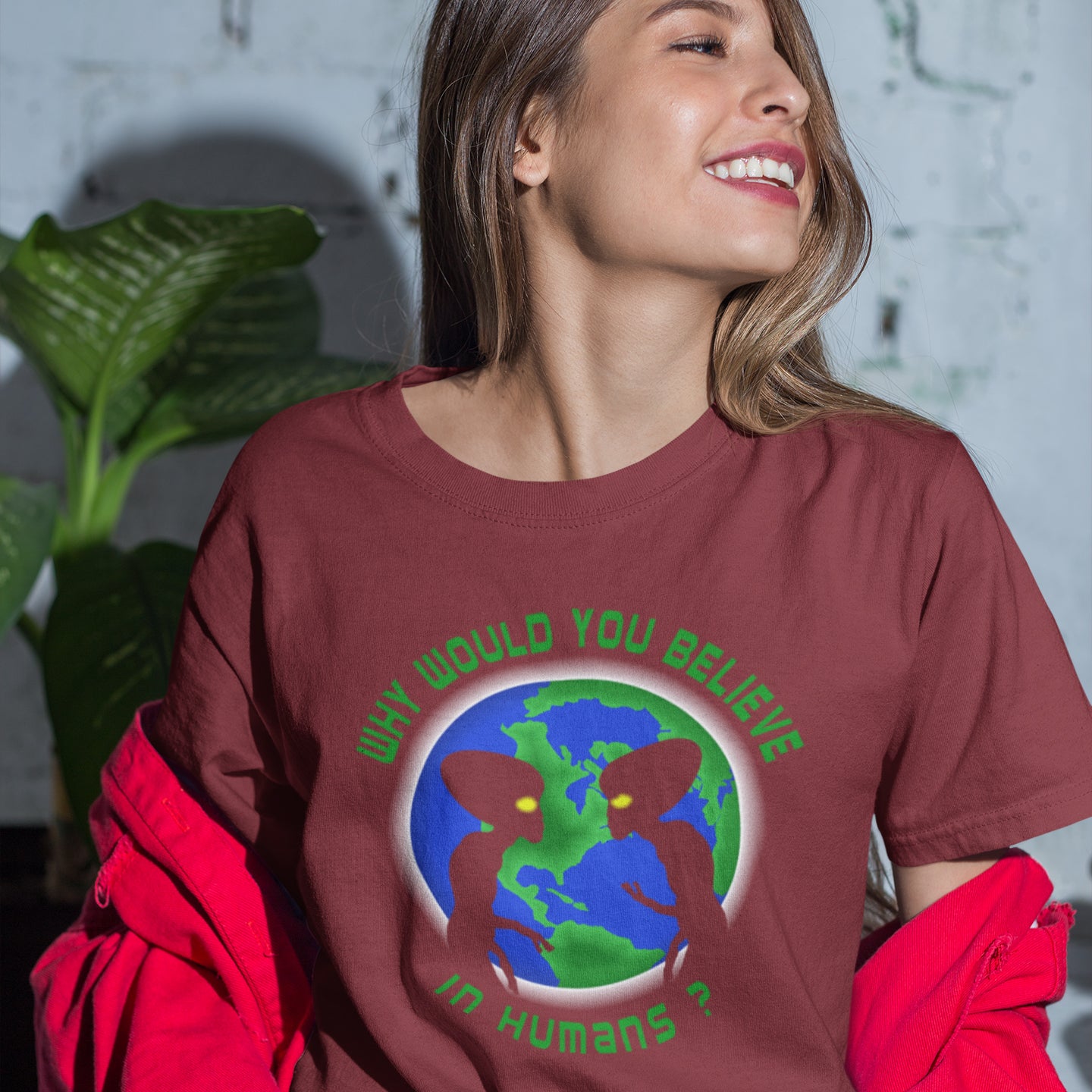 Woman wearing a burgundy t-shirt with an alien and Earth graphic and text. A funny UFO t-shirt with a play on words design. We question whether or not to believe in aliens but with so much evidence around is it not a more important question to wonder if they have lost their faith in us . Made from 100% organic ring-spun cotton, this conspiracy theorist t-shirt is unisex, high-quality, super comfy, and best of all, eco-friendly.