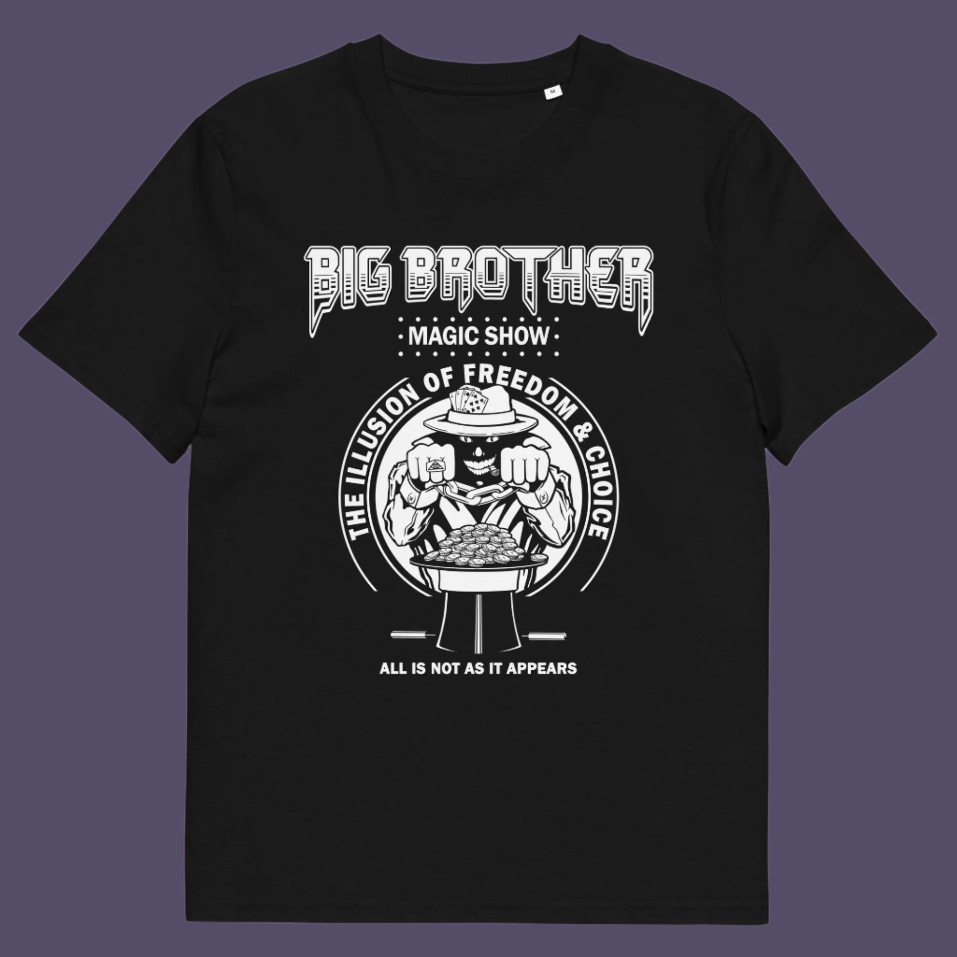 Black t-shirt. A funny conspiracy theory t-shirt suggesting our 'freedom of choice' is just part of an elaborate illusion. Magic shows are great until you realise you are living in one. This witty unique design hints at our society being distracted by greed. Made from 100% organic ring-spun cotton, this witty conspiracy theory t-shirt is unisex, high-quality, super comfy, and best of all, eco-friendly.