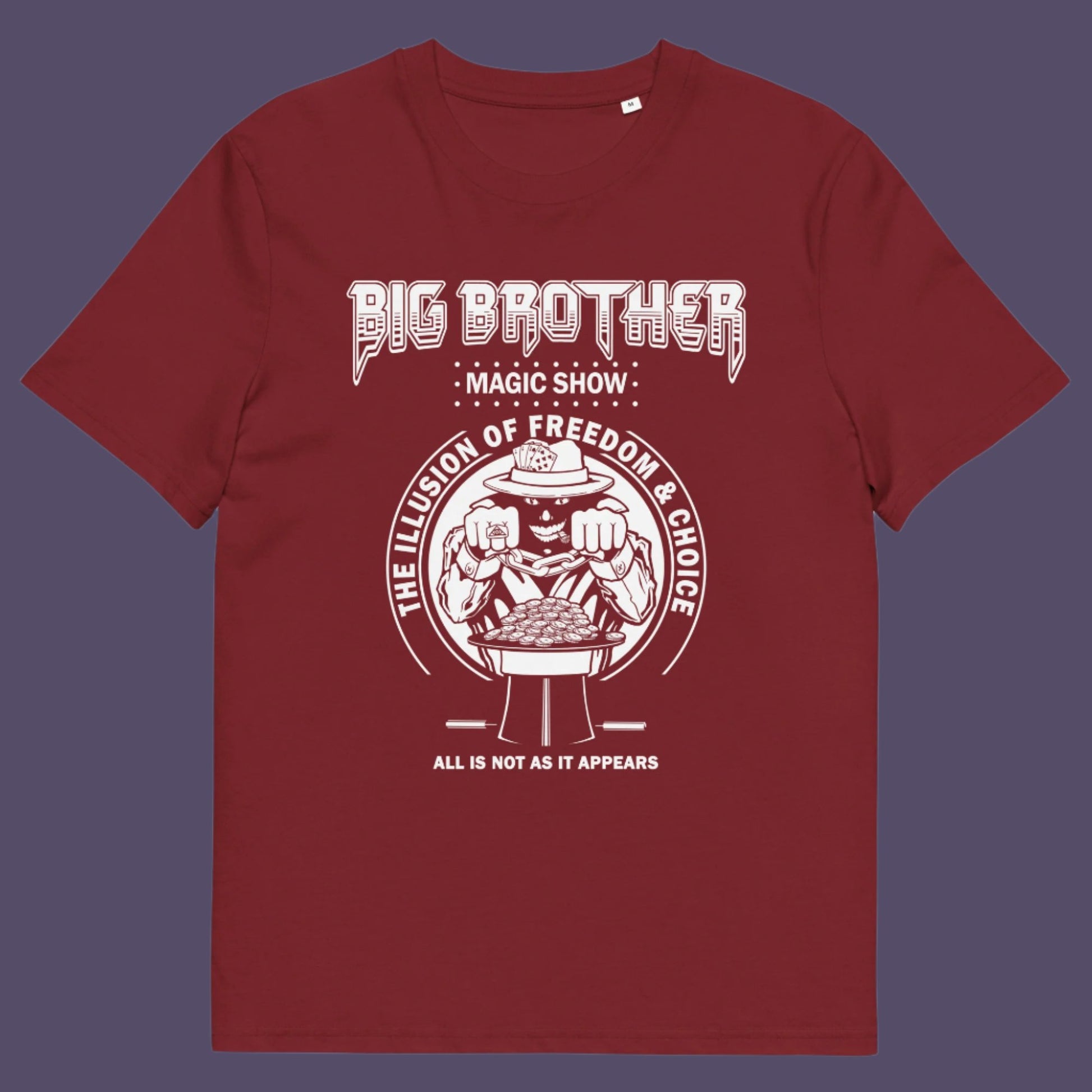 Burgundy t-shirt. A funny conspiracy theory t-shirt suggesting our 'freedom of choice' is just part of an elaborate illusion. Magic shows are great until you realise you are living in one. This witty unique design hints at our society being distracted by greed. Made from 100% organic ring-spun cotton, this witty conspiracy theory t-shirt is unisex, high-quality, super comfy, and best of all, eco-friendly.