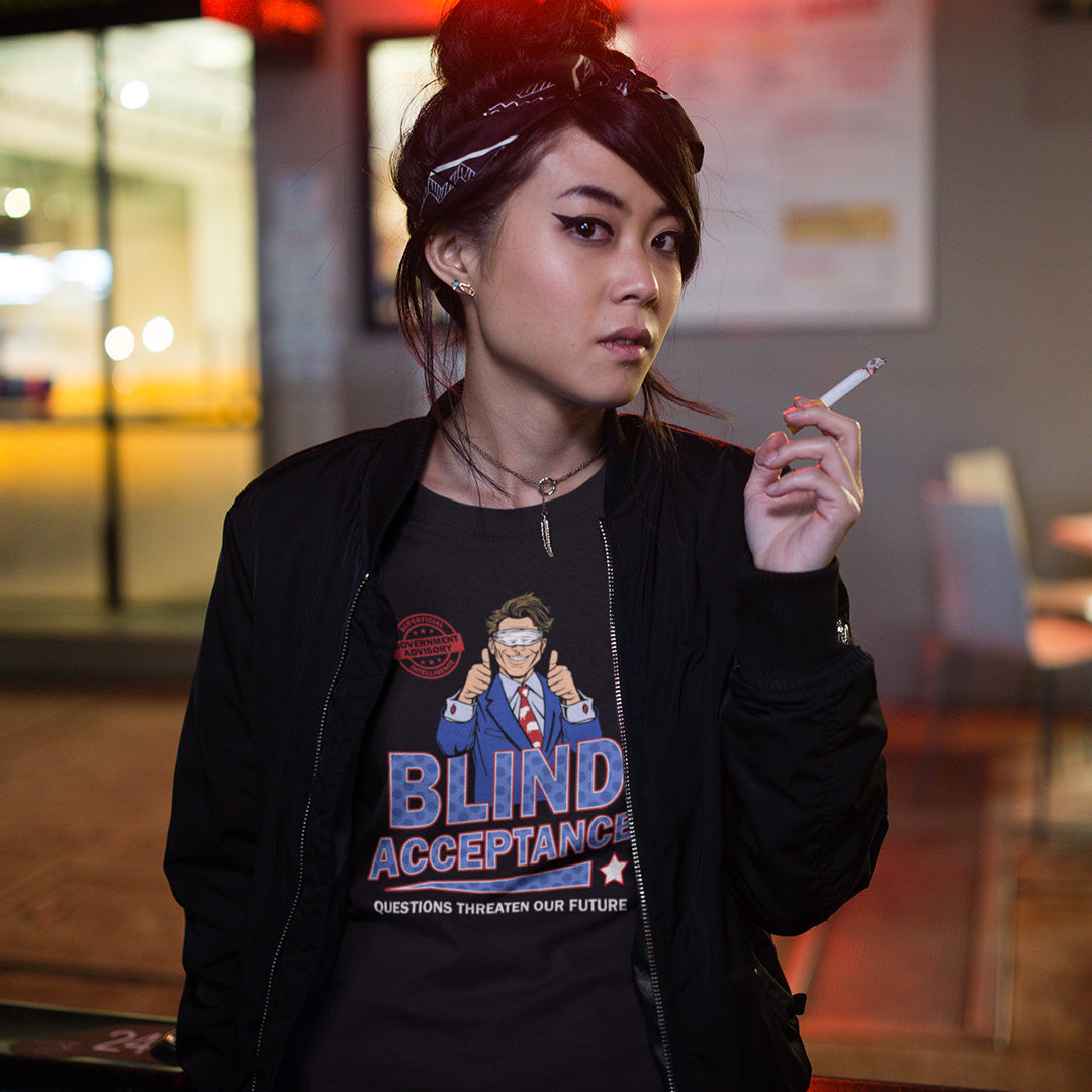 Person wearing a black jacket with a graphic t-shirt, holding a cigarette indoors. A funny election t shirt design in a mock campaign poster style. This satirical urban art design suggests that the preferred approach to politics any government would want from their citizens is one of blind acceptance, or is this already happening ? Made from 100% organic ring-spun cotton, this anti government t shirt is unisex, high-quality, super comfy, and best of all, eco-friendly.