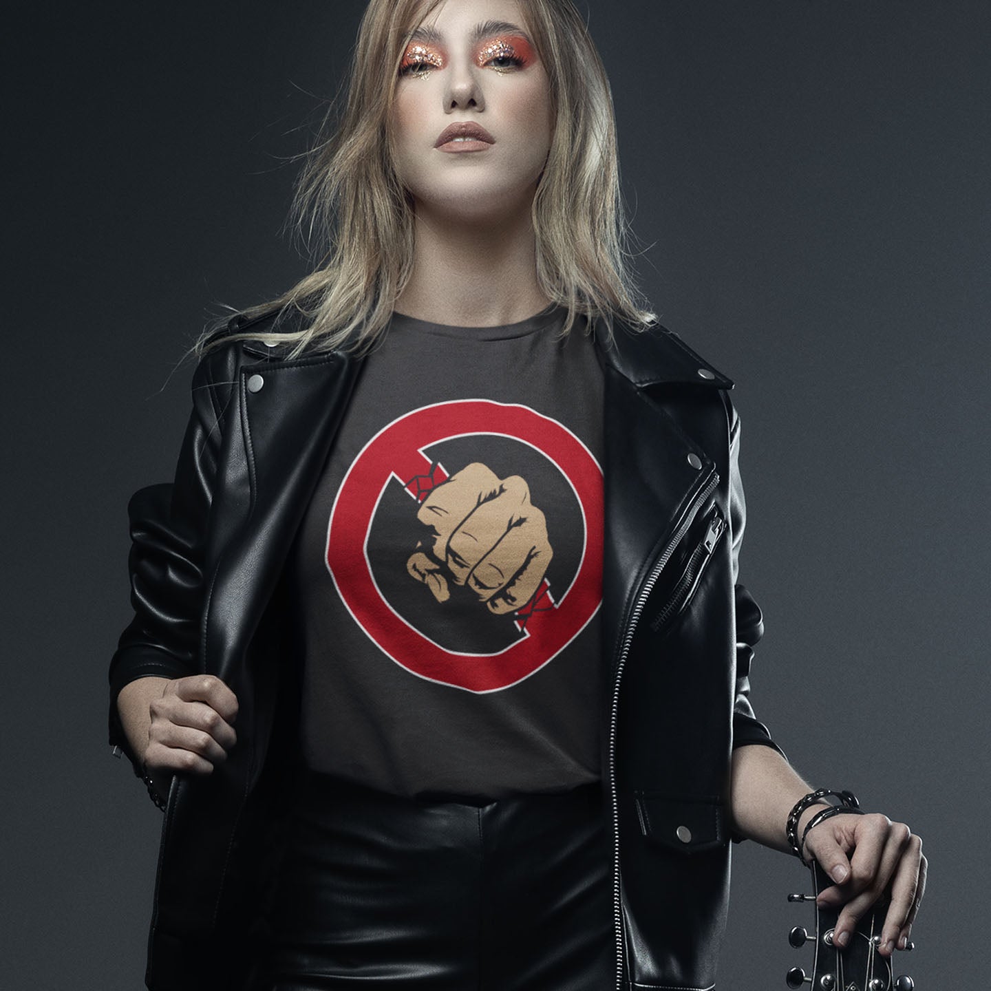 Person wearing a black leather jacket and a t- shirt on a dark background. Non conformist t shirt design. stencil graffiti art for people who think boundaries stifle creativity, and rules are only guidelines. This alternative, anti establishment t-shirt is perfect for any demonstration or protest march of your choice. Made from 100% organic ring-spun cotton, this urban art t shirt is unisex, high-quality, super comfy, and best of all, eco-friendly.