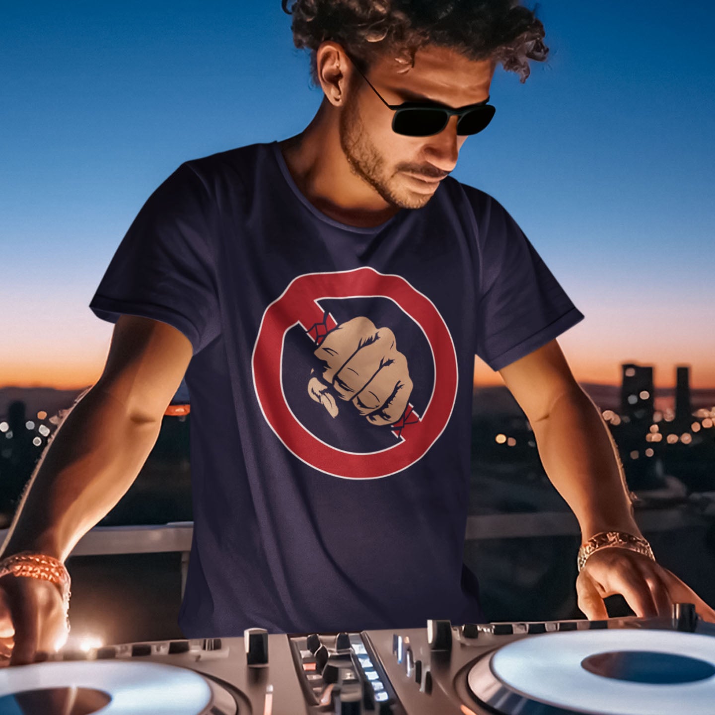Man wearing a navy blue t-shirt with a fist logo, standing at a DJ booth with a cityscape in the background. Non conformist street art for people who think boundaries stifle creativity, and rules are only guidelines. This alternative, anti establishment t-shirt is perfect for any demonstration or protest march of your choice. Made from 100% organic ring-spun cotton, this alternative t-shirt is unisex, high-quality, super comfy, and best of all, eco-friendly.