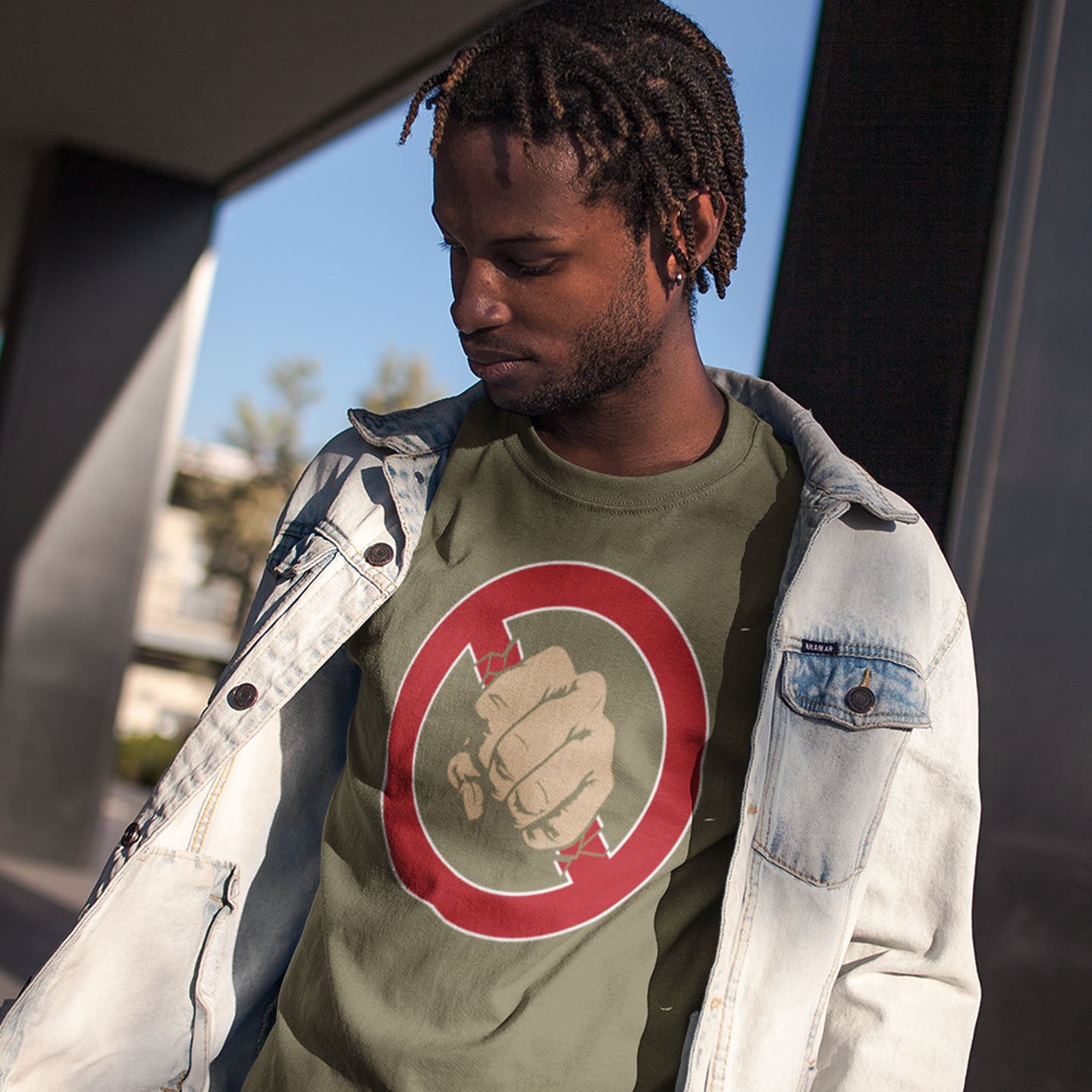 Person wearing a green t-shirt standing outdoors. Non conformist street art for people who think boundaries stifle creativity, and rules are only guidelines. This alternative, anti establishment t-shirt is perfect for any demonstration or protest march of your choice. Made from 100% organic ring-spun cotton, this alternative t-shirt is unisex, high-quality, super comfy, and best of all, eco-friendly.