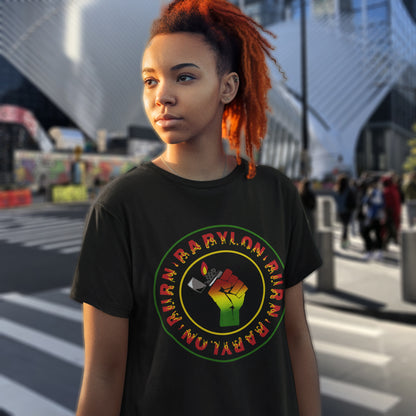 Person wearing a black t-shirt with a colourful graphic design on a city street. A Rastafarian political t-shirt. Babylon is the symbol of corruption and decadence. Take a leaf out of the Rastafarian book with this 'power to the people' anti-corrupt government t-shirt. Made from 100% organic ring-spun cotton, this Rastafarian t-shirt is unisex, high-quality, super comfy, and best of all, eco-friendly.
