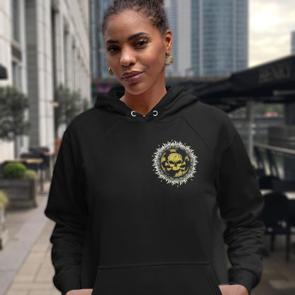 Woman wearing a black hoodie with a yellow and white design in an urban setting. This environmental hoodie is concerned with global warming. A design to keep climate issues at the forefront of peoples minds. A burning issue. Made from 100% organic ring-spun cotton, this environmental awareness hoodie is unisex, high-quality, super comfy, and best of all, eco-friendly.