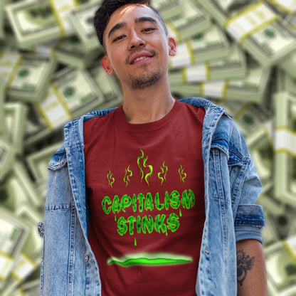 Man wearing a burgundy t-shirt with 'CAPITALISM STINKS' text in front of money background. A funny anti-capitalist t-shirt exposing capitalism for what it really is. Let's face it, Capitalism has had it's day and is just rotting peoples ethics and promoting greed. Show your alternative view with this humorous political t-shirt. Made from 100% organic ring-spun cotton, this anti-capitalist t-shirt is unisex, high-quality, super comfy, and best of all, eco-friendly.
