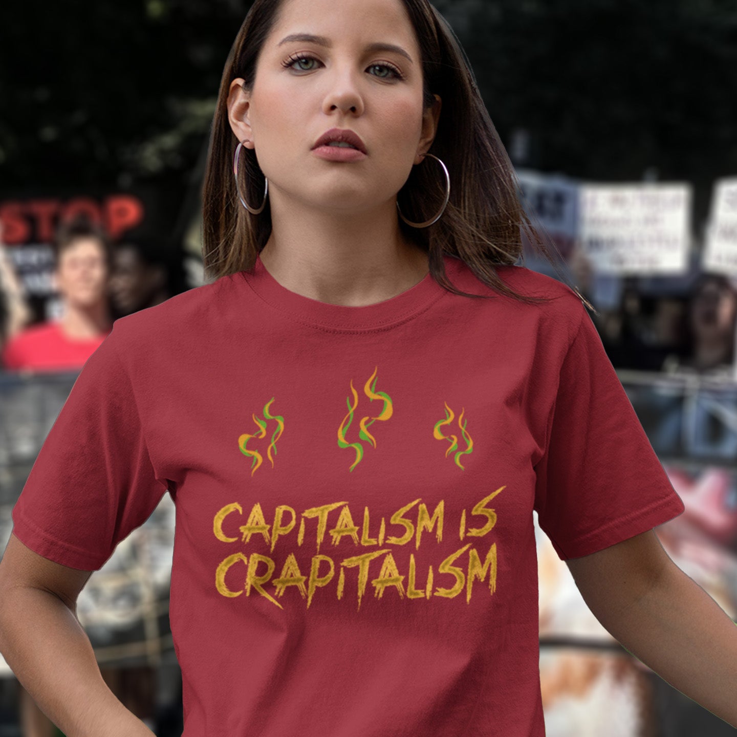 Woman wearing a burgundy t-shirt with 'CAPITALISM IS CRAPITALISM' text and flames. A funny anti-capitalism t-shirt suggesting a letter was left out of the naming of capitalism. This unique anti-establishment t-shirt design argues that the system is crap. Made from 100% organic ring-spun cotton, this anti-capitalist t-shirt is unisex, high-quality, super comfy, and best of all, eco-friendly.
