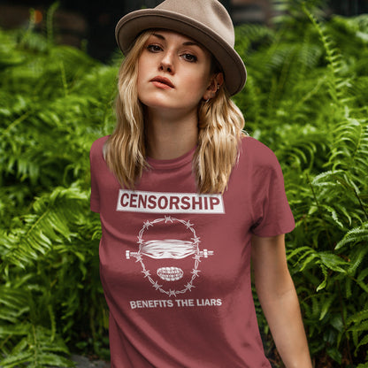Person wearing a burgundy t-shirt with a graphic and text in front of green foliage. This political t-shirt highlights the benefits of censorship. Lies and censorship go hand-in-hand as tools of control and manipulation. This unique design promotes social awareness and freedom of speech. Made from 100% organic ring-spun cotton, this political t-shirt is unisex, high-quality, super comfy, and best of all, eco-friendly.