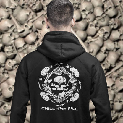 Person wearing a black hoodie with a skull design and 'Chill the Kill' text, standing against a background of skulls. A 'save the planet' hoodie about human impact on nature. An Earth day special. This design highlights the amount of death and destruction we create as a species. Comfortable and practical. It's extra soft and has a convenient front pouch pocket. Made from organic cotton and recycled polyester, this anti-war political hoodie is a great eco-friendly choice.