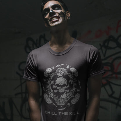 Person wearing a dark t-shirt with a  standing against a graffiti-covered wall. An original save the planet t-shirt. A unique creation in a series of designs about environmental issues and climate concern. This one highlighting the amount of death and destruction we create as a species. Express your counterculture alternative view and encourage social awareness. Made from 100% organic ring-spun cotton, this political t-shirt is unisex, high-quality, super comfy, and best of all, eco-friendly.