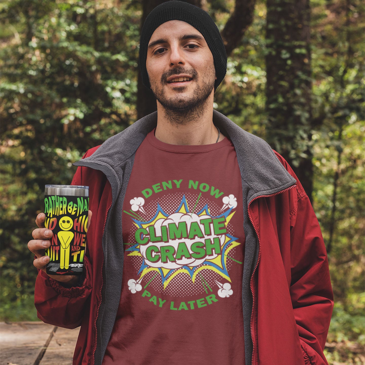 Man holding a mug with a 'Rather be dead' design, wearing a 'Climate Crash Pay Later' shirt in a forest setting.  A satirical save the planet t-shirt designed in a supermarket discount 'Price Crash' style with a play on the 'Buy Now, Pay Later' catchphrase. A dark but witty view of how we need to care more if we want to save the Earth. Made from 100% organic ring-spun cotton, this save the world t shirt is unisex, high-quality, super comfy, and best of all, eco-friendly.