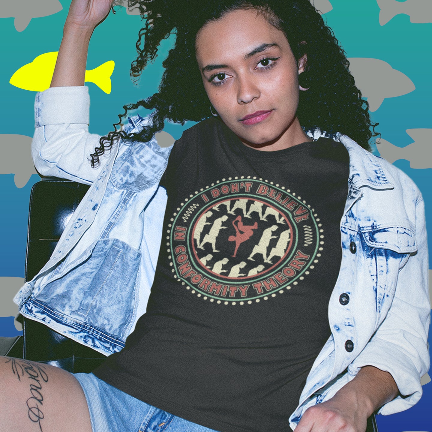 Person wearing a black t-shirt with a graphic design and text, sitting against a colourful abstract background. A non conformist t shirt promoting independent thought. Some people do what they are told without question and wait to be given their opinion. This alternative t-shirt is for the other people. This unique design helps create social awareness of diversity. Made from 100% organic ring-spun cotton, this counter culture t shirt is unisex, high-quality, super comfy, and best of all, eco-friendly.