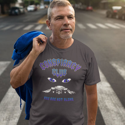 Man wearing a t-shirt with 'Conspiracy Club' design on a street. A conspiracy theorist t shirt design for all conspiracy lovers who think big brother is watching. join the club, expand your independent thinking, question everything. Think outside the box. Made from 100% organic ring-spun cotton, this funny conspiracy theory t shirt is unisex, high-quality, super comfy, and best of all, eco-friendly.