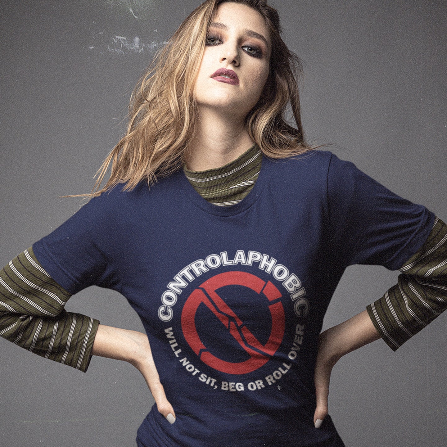 Person wearing a French navy blue sweatshirt with 'Controlaphobia' design. A satirical non conformist t shirt design suggesting there is a lack of freedom of choice, and too much control, in modern society. If you find yourself unable to follow commands and you're not a dog, You may have controlaphobia. Made from 100% organic ring-spun cotton, this unisex social awareness t shirt is high-quality, super comfy, and best of all, eco-friendly.