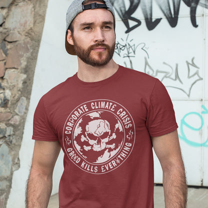 Man wearing a burgundy t-shirt with a graphic design and text, standing against a graffiti-covered wall. An anti corporate t shirt encouraging social awareness and support to save our planet from corporate negligence. Make it clear you are no fool to where the climate problem blame should be placed with this original design. Made from 100% organic ring-spun cotton, this save the world t shirt is unisex, high-quality, super comfy, and best of all, eco-friendly.