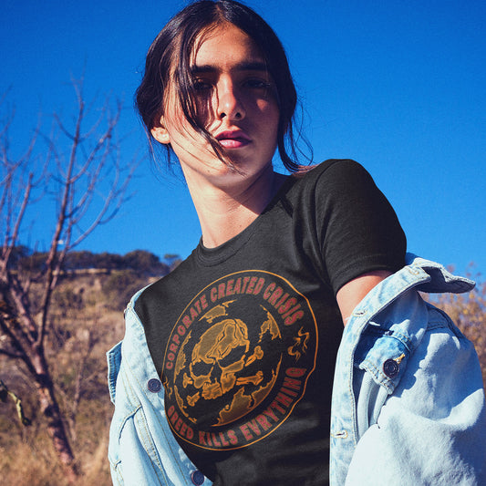 Person wearing a black t-shirt with a skull design outdoors against a blue sky. AN anti-corporate climate concern t-shirt encouraging social awareness and support to save our planet from corporate negligence. Make it clear you are no fool to where the climate problem blame should be placed with this original design. Made from 100% organic ring-spun cotton, this anti corporate t-shirt is unisex, high-quality, super comfy, and best of all, eco-friendly.