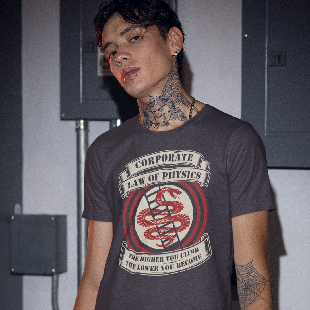 Person wearing a t-shirt with a graphic design and text. A satirical anti corporate t shirt depicting big business as heartless and lacking in morality. In the ever increasing cut throat environment of corporate business it appears that the less integrity you have the more successful you will be. Made from 100% organic ring-spun cotton, this broken society t shirt is unisex, high quality, super comfy, and best of all, eco-friendly.