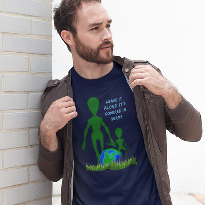 Man wearing a French navy blue t-shirt with an alien and Earth graphic and text. A funny alien t-shirt design with a subtle overpopulation message. In the grand scheme of things, our planet and universe could just be the school project of a child from a superior race. Made from 100% organic ring-spun cotton, this witty alien t-shirt is unisex, high-quality, super comfy, and best of all, eco-friendly.