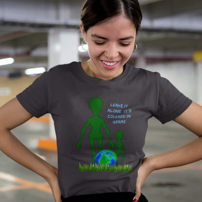 Person wearing a t-shirt with an alien graphic and text in a parking garage. A funny alien t-shirt design with a subtle overpopulation message. In the grand scheme of things, our planet and universe could just be the school project of a child from a superior race. Made from 100% organic ring-spun cotton, this witty alien t-shirt is unisex, high-quality, super comfy, and best of all, eco-friendly.