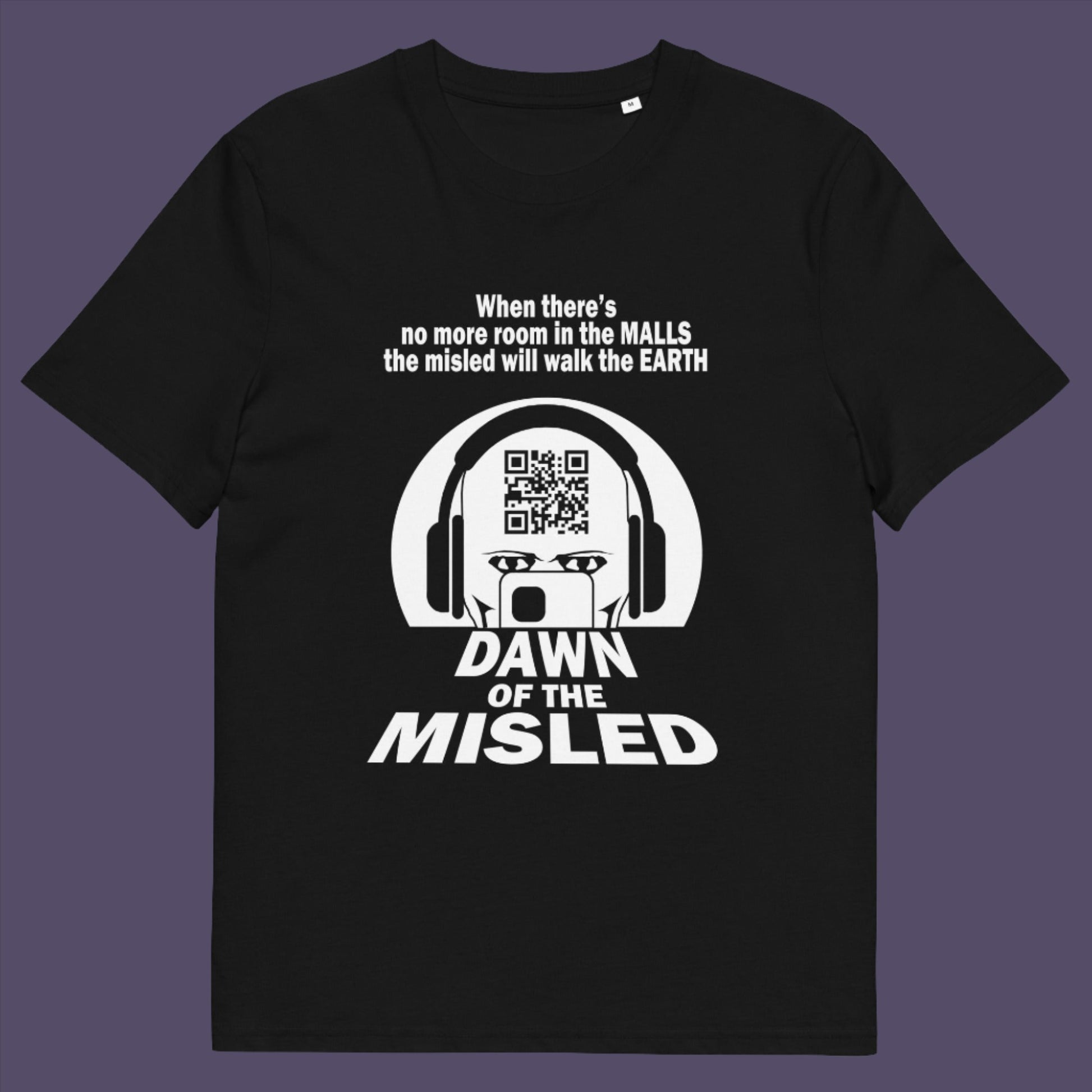 Black t-shirt. A counterculture t-shirt in the theme of a famous 1970's horror movie. This satirical design highlights the modern consumer who buys what they are told to buy by social media and corporate advertising. Made from 100% organic ring-spun cotton, this underground anti-consumerism t-shirt is unisex, high-quality, super comfy, and best of all, eco-friendly.