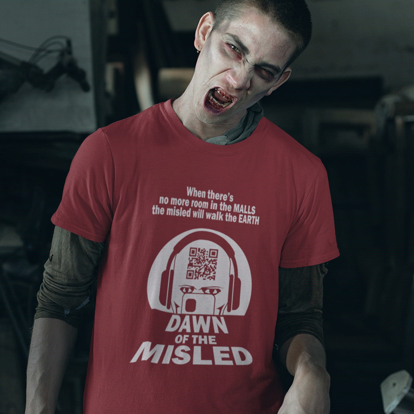 Person wearing a burgundy t-shirt with a  horror movie graphic design and text. A counterculture t-shirt in the theme of a famous 1970's horror movie. This satirical design highlights the modern consumer who buys what they are told to buy by social media and corporate advertising. Made from 100% organic ring-spun cotton, this underground anti-consumerism t-shirt is unisex, high-quality, super comfy, and best of all, eco-friendly.